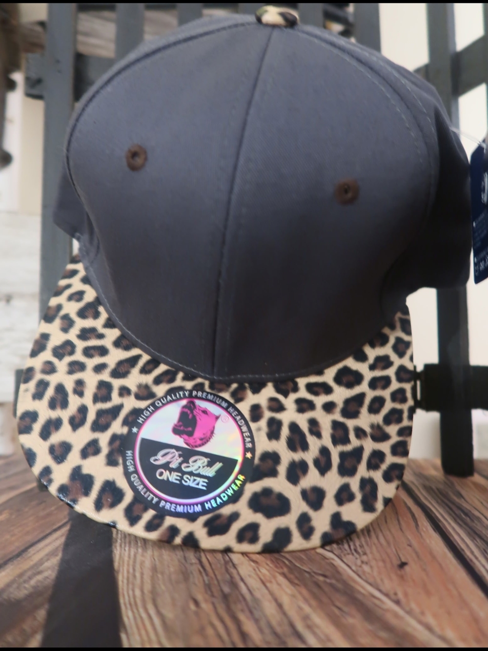 One Size Black Snapback Cap with Leopard Brim